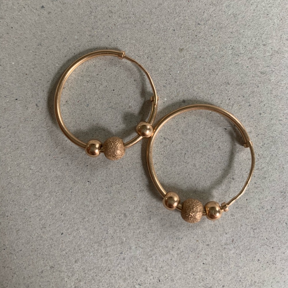 Gold earrings . Perfect condition.